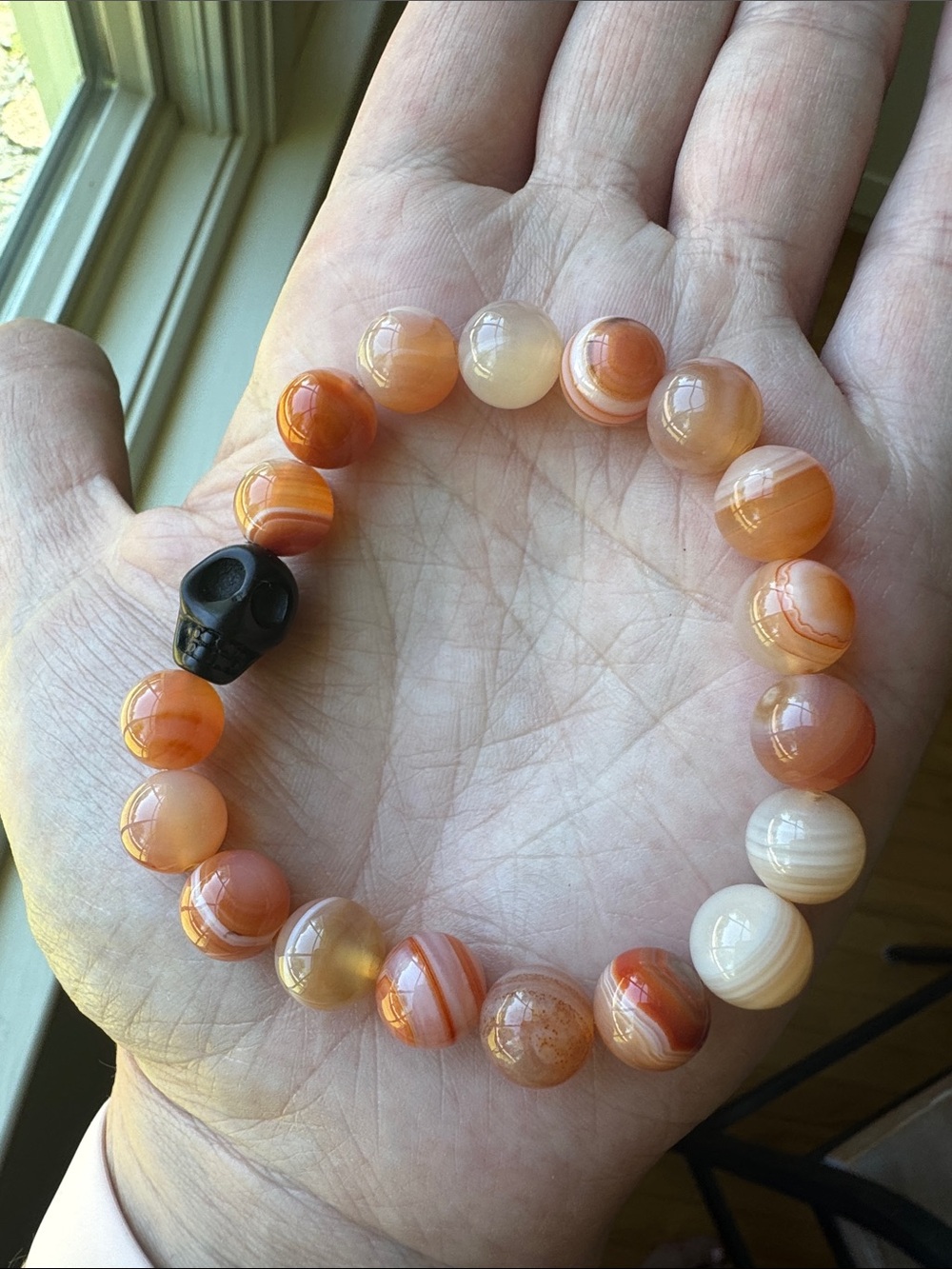 Orange Carnelian Agate Beaded Bracelet with Black Skull Accent